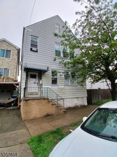 view of front of house with fence