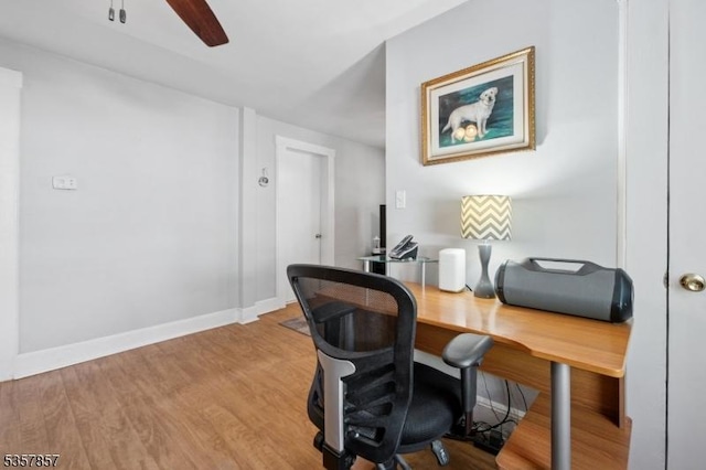 office space with wood finished floors, ceiling fan, and baseboards