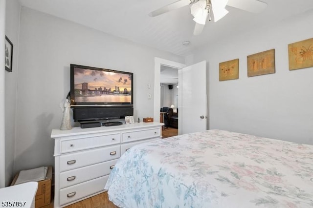 bedroom with wood finished floors and ceiling fan