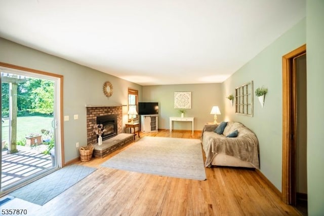living area with wood finished floors and baseboards