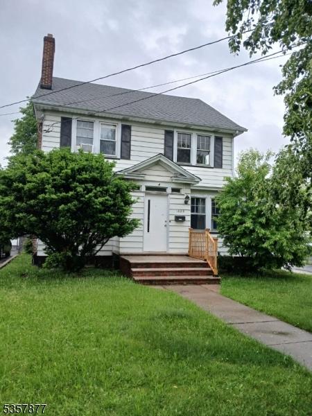 1029 Kipling Rd, Elizabeth City, NJ 07208 - view of front of house with a chimney and a front yard