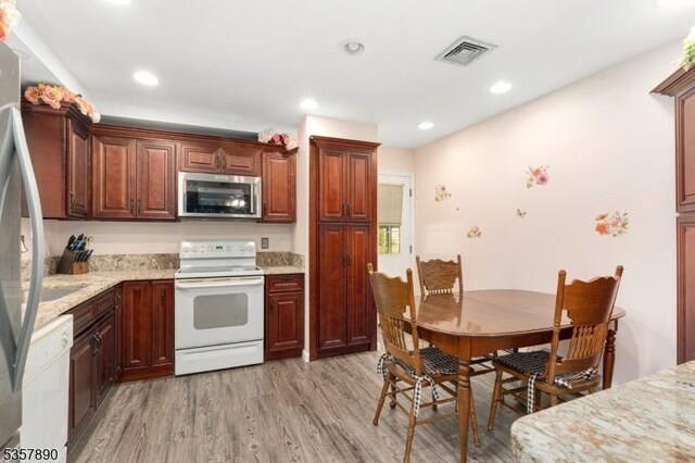 125 Annandale High Bridge Rd, Clinton Twp, NJ 08801 - kitchen featuring stainless steel appliances, light wood-type flooring, light stone counters, and recessed lighting