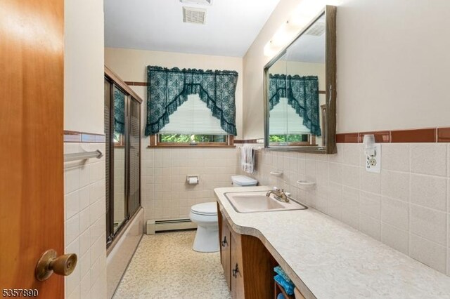 125 Annandale High Bridge Rd, Clinton Twp, NJ 08801 - full bathroom with baseboard heating, vanity, wainscoting, toilet, and bath / shower combo with glass door