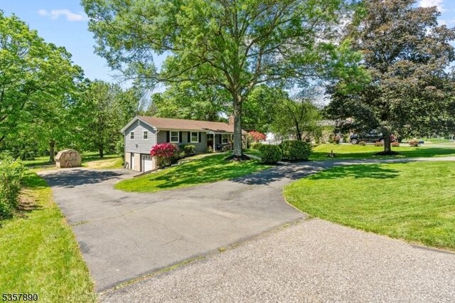 125 Annandale High Bridge Rd, Clinton Twp, NJ 08801 - ranch-style home featuring asphalt driveway, a garage, and a front lawn