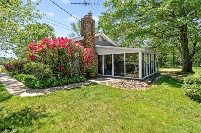 125 Annandale High Bridge Rd, Clinton Twp, NJ 08801 - back of house featuring a sunroom, a chimney, and a yard