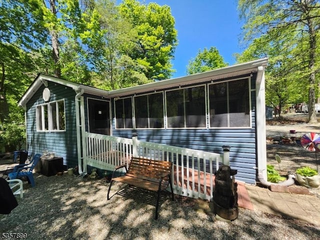 30 Hemlock Vlg, Vernon Twp, NJ 07461 - rear view of property with a sunroom