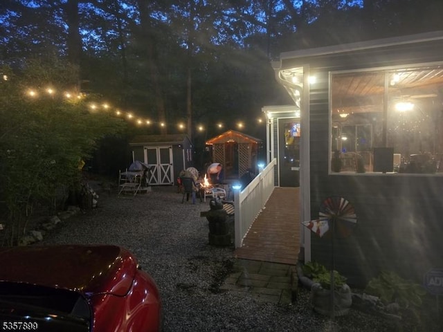 30 Hemlock Vlg, Vernon Twp, NJ 07461 - patio at twilight featuring a shed