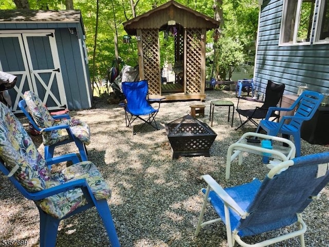 30 Hemlock Vlg, Vernon Twp, NJ 07461 - view of patio / terrace with a fire pit and a shed