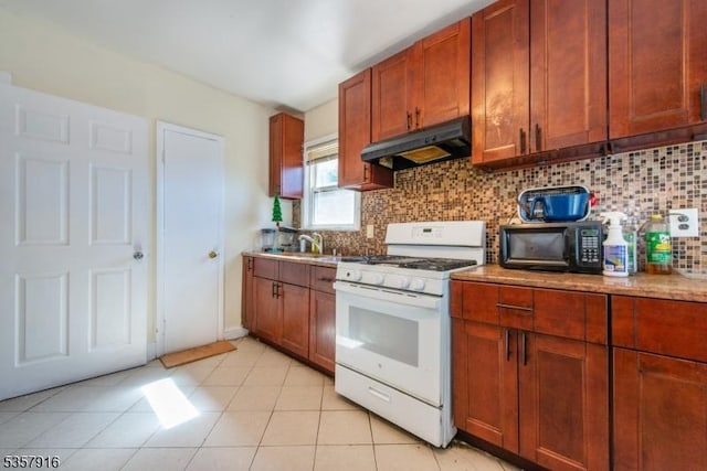 152 Greenwood Ave Unit 2, East Orange City, NJ 07017 - kitchen with under cabinet range hood, gas range gas stove, black microwave, tasteful backsplash, and a sink
