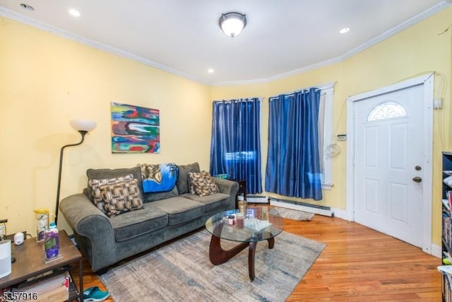 152 Greenwood Ave Unit 2, East Orange City, NJ 07017 - living room featuring wood finished floors, a baseboard heating unit, crown molding, and recessed lighting