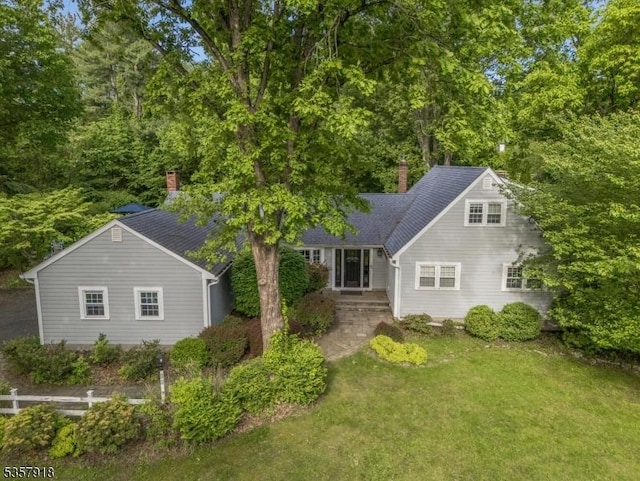 23 Drake Rd, Mendham Boro, NJ 07945 - view of front facade featuring a chimney and a front lawn