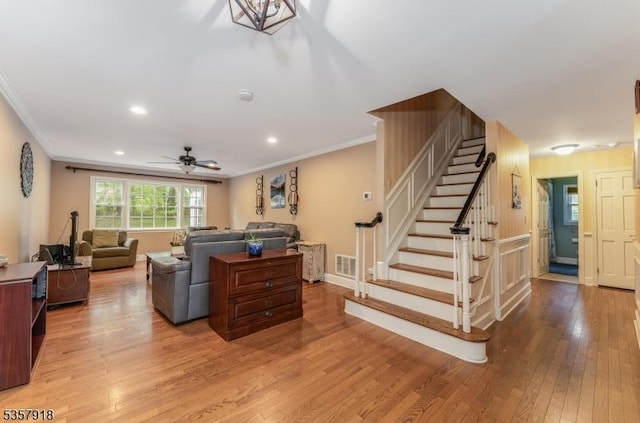 23 Drake Rd, Mendham Boro, NJ 07945 - living area with crown molding, wood finished floors, stairway, a ceiling fan, and recessed lighting