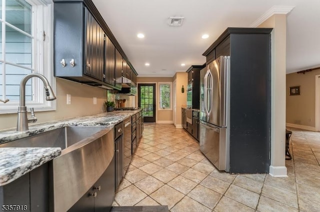 23 Drake Rd, Mendham Boro, NJ 07945 - kitchen with freestanding refrigerator, ornamental molding, a sink, baseboards, and light stone countertops