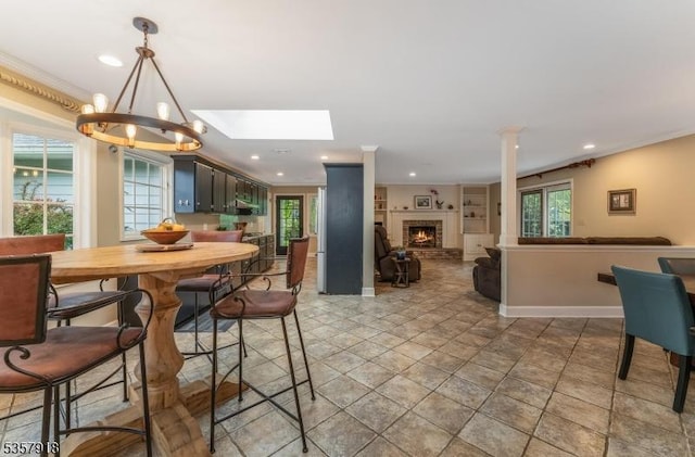 23 Drake Rd, Mendham Boro, NJ 07945 - dining room featuring baseboards, recessed lighting, a skylight, a chandelier, and a brick fireplace