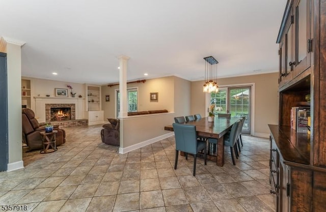 23 Drake Rd, Mendham Boro, NJ 07945 - dining room with a fireplace, baseboards, built in shelves, and recessed lighting