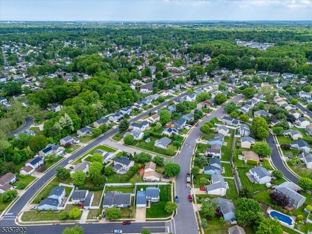 aerial view of property's location with nearby suburban area