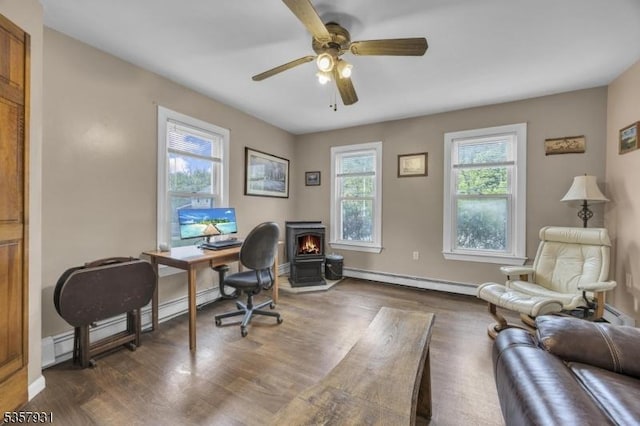 home office with a baseboard heating unit, dark wood-style flooring, a ceiling fan, baseboards, and a baseboard radiator