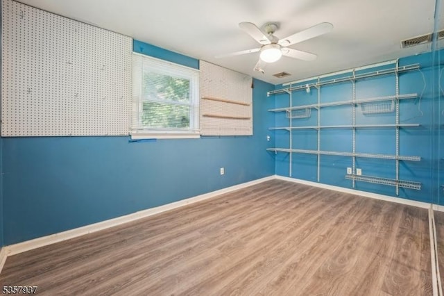 12 Xenia Ct, Mine Hill Twp, NJ 07803 - unfurnished room with wood finished floors, a ceiling fan, and baseboards