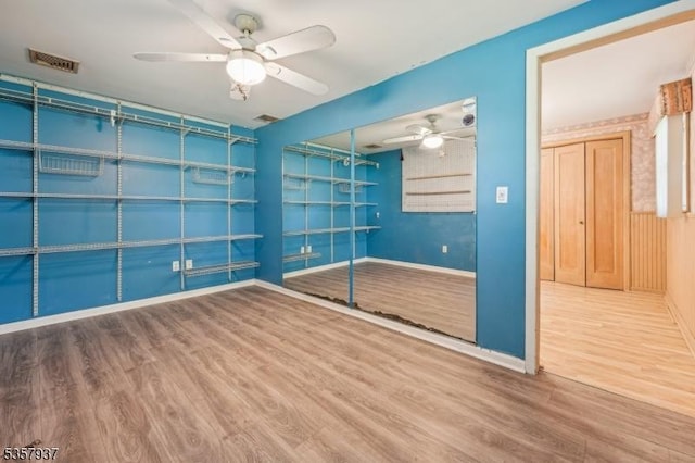 12 Xenia Ct, Mine Hill Twp, NJ 07803 - empty room featuring wood finished floors, a ceiling fan, and baseboards