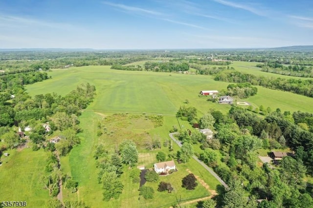 aerial view of property and surrounding area featuring rural landscape