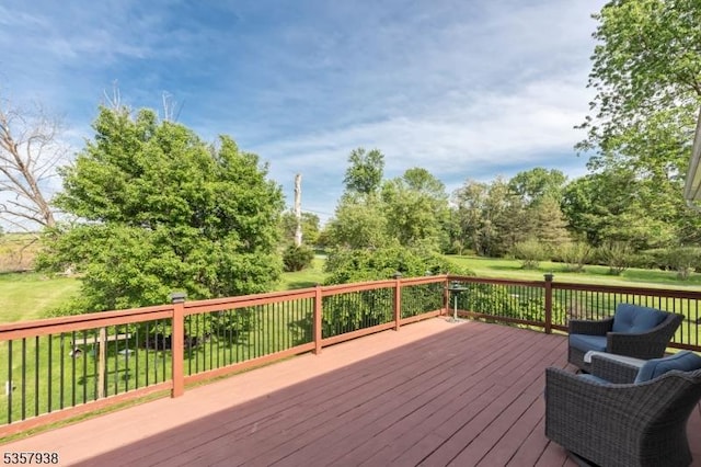 wooden terrace featuring a lawn