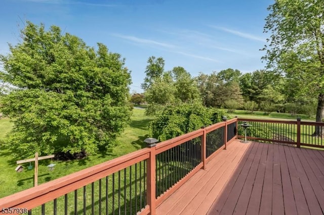 wooden terrace with a yard