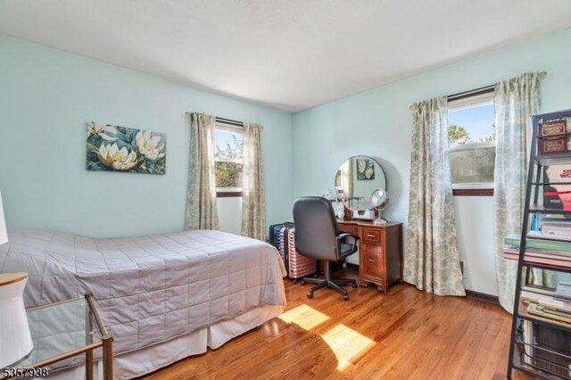 bedroom featuring wood finished floors