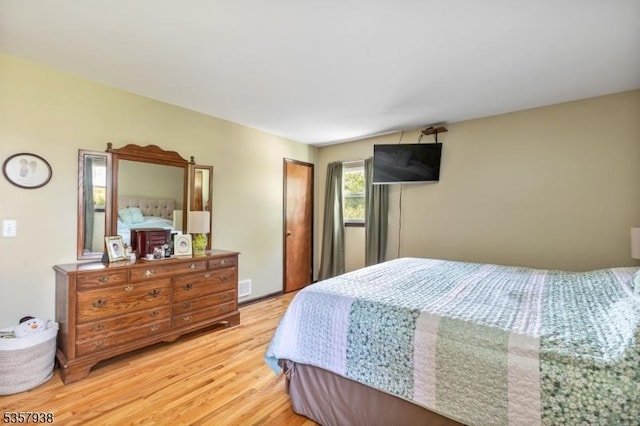 bedroom featuring light wood-style flooring