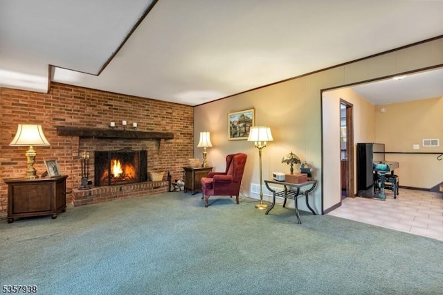 sitting room featuring baseboards, a brick fireplace, and carpet flooring