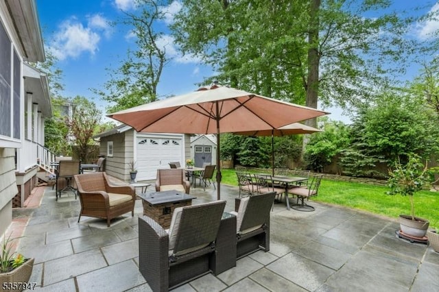 view of patio featuring outdoor dining area and an outdoor structure