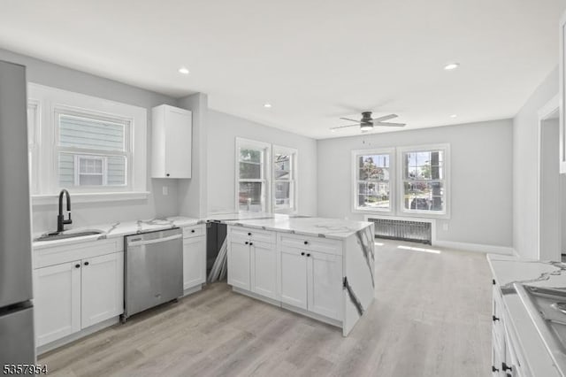 56 Laventhal Ave, Irvington Twp, NJ 07111 - kitchen featuring dishwasher, a sink, radiator, ceiling fan, and a peninsula