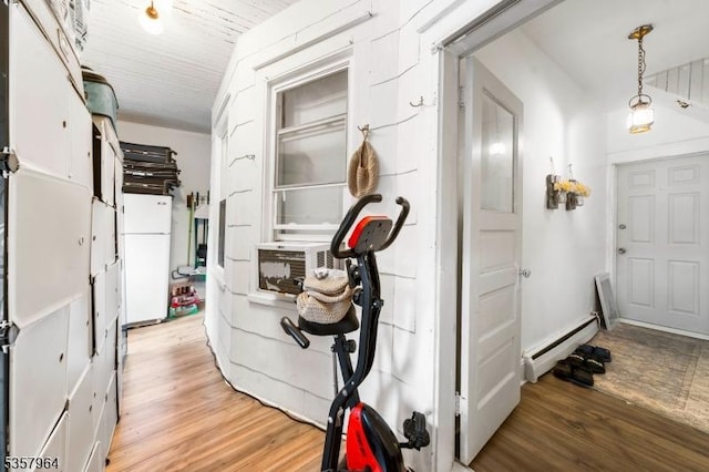 entryway featuring light wood finished floors and baseboard heating