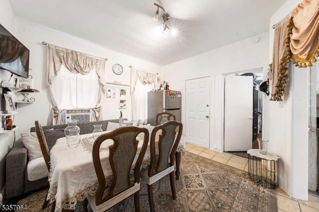 dining area with light tile patterned flooring and cooling unit