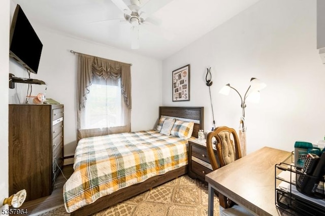 bedroom featuring wood finished floors and ceiling fan