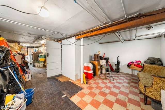 finished below grade area featuring tile patterned floors