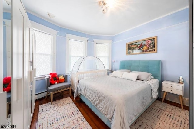 bedroom with wood finished floors