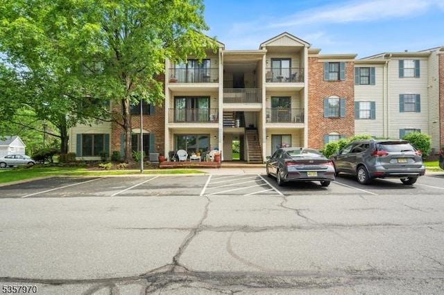 26 Fisher Dr Unit 2704, Franklin Twp, NJ 08823 - view of property featuring uncovered parking