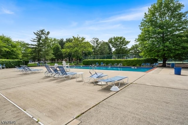 26 Fisher Dr Unit 2704, Franklin Twp, NJ 08823 - community pool with a patio and view of scattered trees