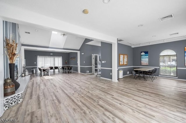 26 Fisher Dr Unit 2704, Franklin Twp, NJ 08823 - living area with wood finished floors, vaulted ceiling, and baseboards