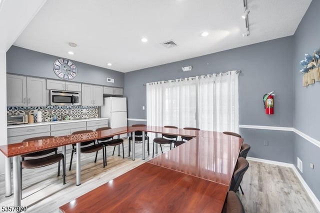 26 Fisher Dr Unit 2704, Franklin Twp, NJ 08823 - dining space featuring light wood-style floors, baseboards, rail lighting, and recessed lighting