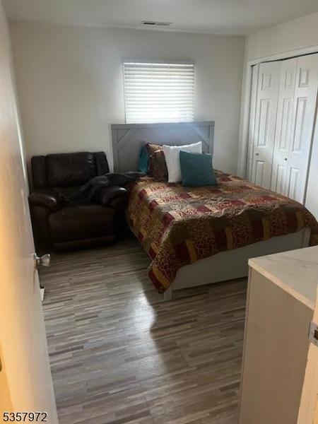 800 Raritan Rd, Clark Twp, NJ 07066 - bedroom featuring wood finished floors and a closet