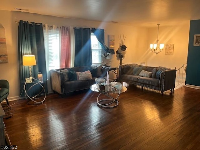 800 Raritan Rd, Clark Twp, NJ 07066 - living room with a chandelier, wood-type flooring, and baseboards