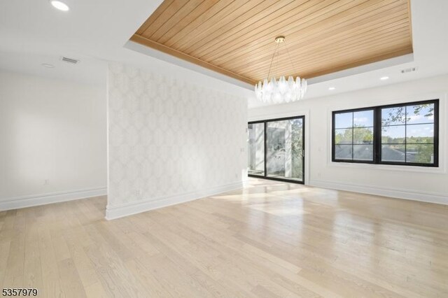 370 Hartshorn Dr, Millburn Twp, NJ 07078 - spare room featuring a tray ceiling, plenty of natural light, baseboards, a chandelier, and wooden ceiling
