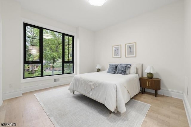 370 Hartshorn Dr, Millburn Twp, NJ 07078 - bedroom with light wood-style flooring and baseboards