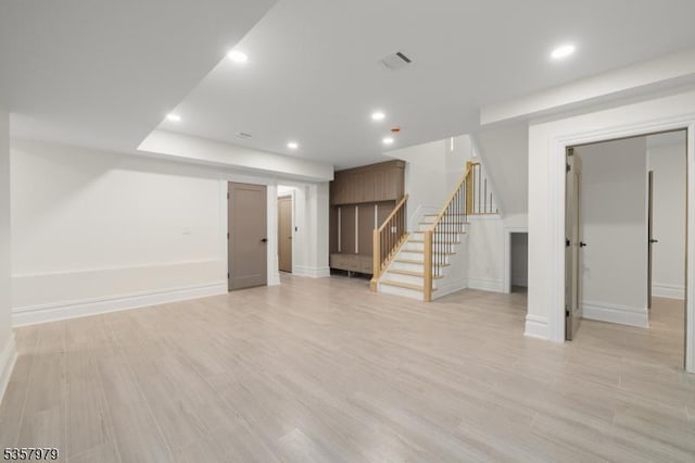 370 Hartshorn Dr, Millburn Twp, NJ 07078 - below grade area featuring stairway, recessed lighting, light wood-style floors, and baseboards