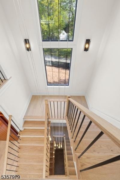 370 Hartshorn Dr, Millburn Twp, NJ 07078 - stairway featuring wood finished floors and baseboards
