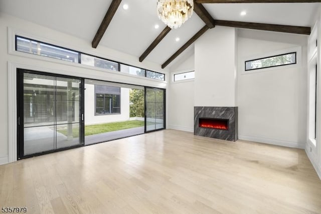 370 Hartshorn Dr, Millburn Twp, NJ 07078 - unfurnished living room featuring a high end fireplace, beamed ceiling, high vaulted ceiling, baseboards, and a chandelier