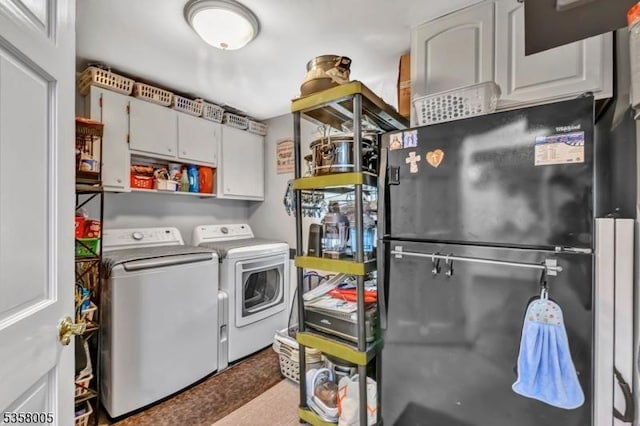laundry area featuring washing machine and clothes dryer
