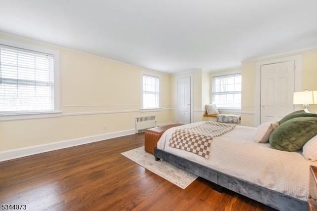 537 Summit Ave, Maplewood Twp, NJ 07040 - bedroom featuring radiator heating unit, wood finished floors, multiple closets, baseboards, and crown molding