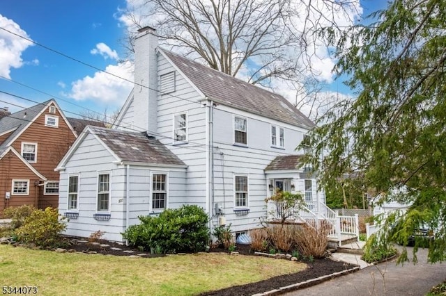 537 Summit Ave, Maplewood Twp, NJ 07040 - view of side of property with a chimney, a yard, and roof with shingles